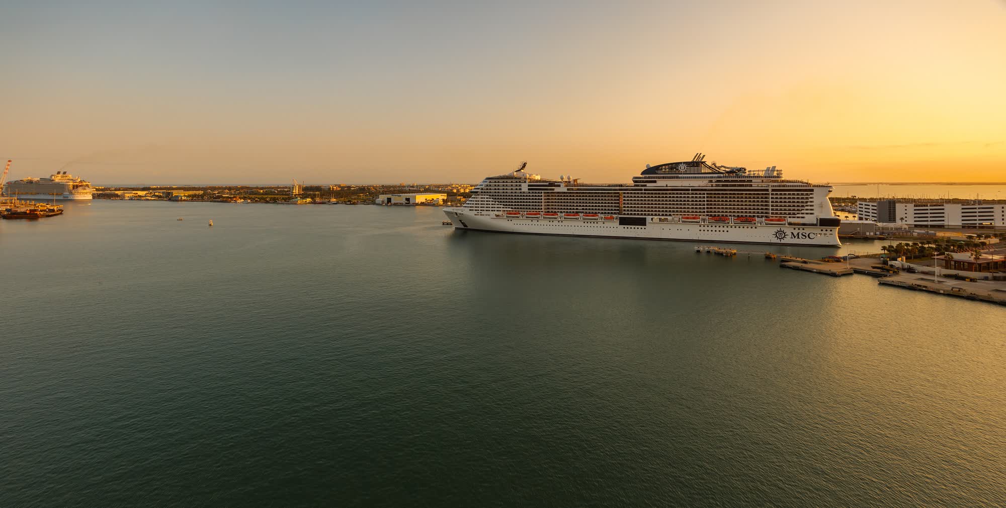 Cruise ship departing at sunset
